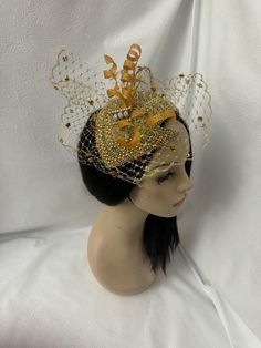 Absolutely beautiful! This is a couture and elegant unique cut design OOAK (one of a kind) vintage 1920 flapper styled pearl beaded with rhinestone jeweled half hat fascinator with metallic gold dotted veil    perfect for weddings, Mother of the Bride hat, Bridal fascinator hat, Church hats, COGIC women convention hats, tea parties, cocktail parties  and special occasion headpiece. Looking for a unique handmade fashion lover gift for women, then this is a perfect gift.  E A S Y  T O  W E A R  Fo Handmade Gold Hat For Kentucky Derby, Elegant Carnival Hat Headpiece, Gold Round Crown Headpiece For Weddings, Gold Wedding Headpiece With Round Crown, Party Crown Headpiece With Beads, Vintage Gatsby Style Hat Headpiece, Gatsby Style Hat For Vintage Events, Gold Crown Costume Headpiece For Weddings, Elegant Handmade Headpiece With Structured Crown