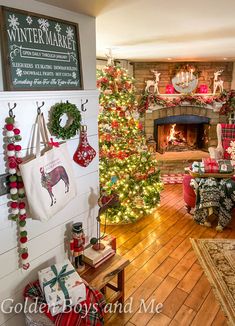 a living room decorated for christmas with fireplace and tree