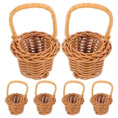 four small wicker baskets with handles on each side and three smaller ones in the middle