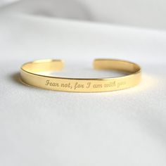 Looking for a unique gift for a deeply religious person? Inspirational faith-based bracelet with message of faith, hope and love or uplifting words of encouragement will be a perfect gift. - Gold bracelet engraved with your chosen message. - The  thickness of gold plating is around 0.5 microns - Text, coordinates, numbers or handwriting outside and inside the cuff  - Up to 90 characters  on each side - Approximately 0.25 inch wide (6.3mm) - Laser engraved - the engraving is burned into the mater Engraved Gold Bracelet, 90 Characters, Faith Hope And Love, Gold Cuff Bracelet, God Christian, Wrist Jewelry, Uplifting Words, Gold Bracelet Cuff, Engraved Bracelet