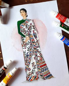 a drawing of a woman wearing a white and green dress with colorful designs on it