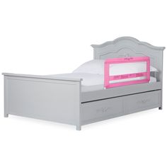 a child's bed with a pink and white mattress on top of it, in front of a white background