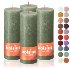 three large candles with different colors and sizes in each candle, the one on top has an orange label that says bolsius since 1970