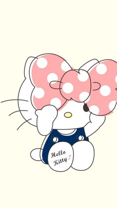 a hello kitty wallpaper with polka dots on the top and bottom half of it