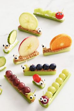 many different fruits and vegetables are arranged in the shape of caterpillars with eyes on them