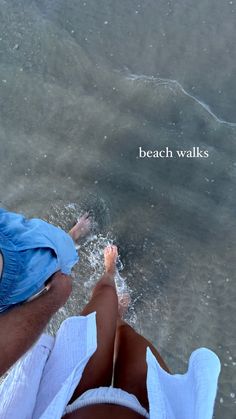 two people are sitting on the beach with their feet in the water and there is a quote above them that reads, beach walks