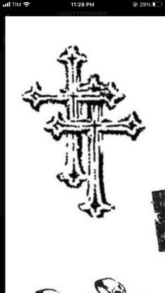 an image of a cross with skulls on it