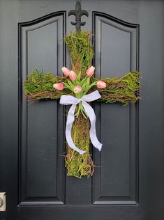 Adorn your front door for Easter with this unique wreath. This beautiful Easter Cross Wreath combines the symbol of the cross with the meaning of tulips - "deep and perfect love". This is by far one our best selling wreaths year after year. The Easter Cross Wreath will welcome your guests during this Spring holiday with happiness and warmth. You have your choice of which color tulips; pick from our colorful variety of “real touch” tulips! Easter Cross Wreath, Tulips Meaning, Spring Deco Mesh Wreaths, Easter Front Door, Wreath Hangers, Cross Wreath, Wreath Hanger, Tulip Bouquet, Easter Cross