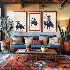 a living room filled with furniture and paintings on the wall above it's coffee table