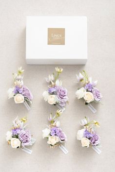 wedding hair combs with flowers and ribbons in a box on the floor next to it