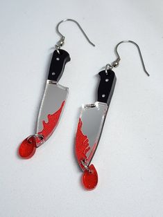 Impress your friends (and, ahem, your enemies) with these unique, handmade Bloody Knife Earrings. Perfect for adding a punk-rock edge to any outfit, they're sure to cause a stir wherever you go! Wear them in style and let your ears do the talking. Horror Earrings Clay, Handmade Punk Jewelry For Alternative Fashion, Punk Handmade Jewelry For Alternative Fashion, Handmade Emo Jewelry For Festivals, Handmade Punk Red Jewelry, Handmade Red Punk Jewelry, Handmade Edgy Halloween Jewelry, Handmade Edgy Jewelry For Halloween, Edgy Handmade Jewelry Gift