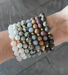 I love adding in a little something different to my bracelet stacks! These gemstone bead bracelets are perfect for that!  This listing is for ONE bracelet (your choice) and gold accents. There are 8 options to choose from! Wear alone, wear multiples, or add to another stack for a fun combination! The possibilities for this chunky wooden bracelet are endless!   The bracelets are 7", which fits average adult wrists.  I use a strong, stretchy cord for a nice, comfortable fit.  They are ready to shi Bohemian Stackable Beaded Bracelets For Everyday, Casual Everyday Charm Bracelet With Round Beads, Casual Stackable Round Beaded Jewelry, Bohemian Stackable Bracelets With Round Beads, Hand Wrapped Beaded Bracelets For Everyday, Casual Stackable Bracelets With Round Beads, Bohemian Stackable Round Bead Bracelets, Spiritual Round Bead Bracelets For Everyday, Bohemian Stackable Crystal Bracelet As Gift