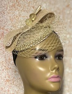 Looking for a show-stopper? Look no further! This small sinamay piece speaks volumes.  Perfect for church, weddings, tea parties and other special occasions. Gold sinamay fascinator accented with a bow, veiling  and decorative pin. The hat pin may vary and is for decorative purposes only.  The hat is affixed to the head via a hat string. Handmade Gifts for mom, sister, wife, or yourself. Measures:  7 inches in diameter  PLEASE NOTE All items for Free Shipping will be shipped via USPS First Class Gold Fitted Headpieces For Formal Occasions, Elegant Gold Mini Hat For Royal Ascot, Elegant Mini Hat For Royal Ascot In Gold, Adjustable Pinched Crown Fascinator For Church, Gold Fascinator Hat For Party, Elegant Fascinator For Vintage Events, Elegant Headpiece For Kentucky Derby, Gold Hat, Gold Adjustable Fascinator For Church