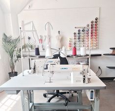 a sewing machine sitting on top of a white table