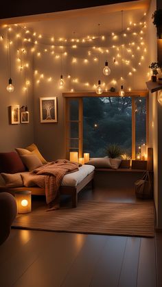 a living room filled with lots of lights next to a large window covered in blankets