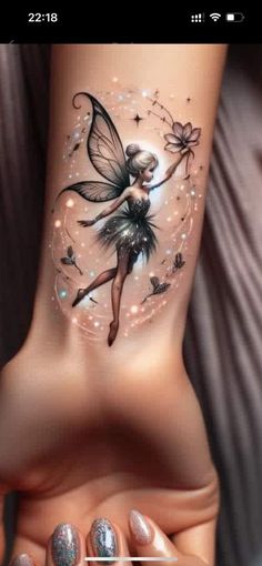 a woman's foot with a fairy tattoo on the side of her leg and an image of a flower