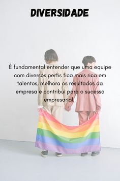 two children holding a rainbow flag in front of a white wall with the words diversidade on it