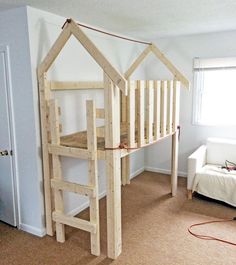 a loft bed made out of wooden planks