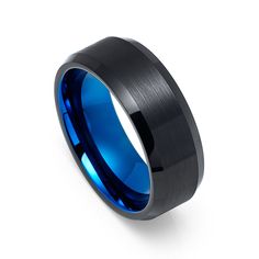 a black and blue wedding ring with an inlay design on the center, set against a white background