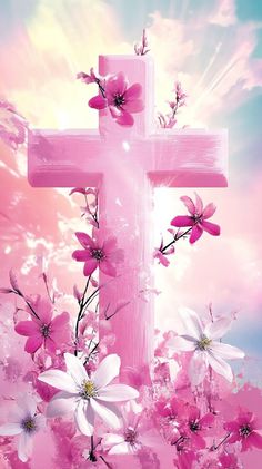 the cross is surrounded by pink flowers