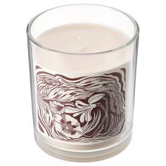 a glass candle with an image of a woman on it