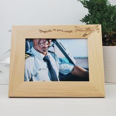 a wooden frame with an image of a man in uniform and the words congratulate my hero on it