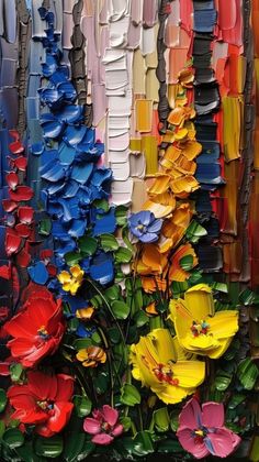 an image of colorful flowers in the middle of many different colors and shapes on display