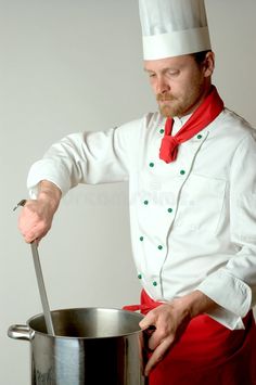 a man in a chef's outfit is stirring something into a pot with a ladle