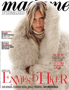 a magazine cover with a blonde woman wearing a fur coat and scarf on it's head