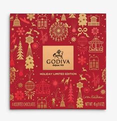 a red box with gold foil on it that says godiva holiday limited edition