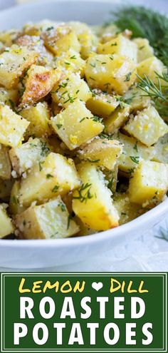 a white bowl filled with roasted potatoes covered in lemon dill