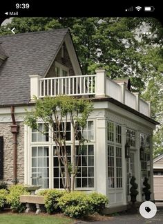 a house with white trim and large windows