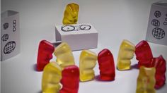 several gummy bears sitting next to each other on top of a white countertop