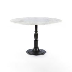 a white marble table with black metal pedestals and an iron base, on a white background