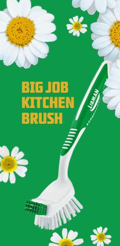 a green background with white daisies and a toothbrush in the foreground that says,'big job kitchen brush '