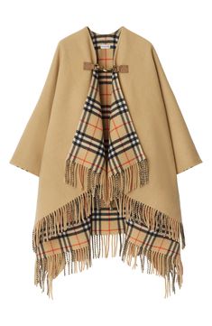 From the Burberry Classics collection, this Italian-made wool cape doubles up on brand icons with three-bar check patterning on the inside and a horse-shaped clip closure inspired by the Equestrian Knight design. 55" x 55" (One Size) Lobster clasp closure 100% wool Dry clean Made in Italy Burberry Poncho, Burberry Cape, Knight Design, Poncho Dress, Cape Designs, Brand Icon, Wool Cape, Sand Beige, Red Wool