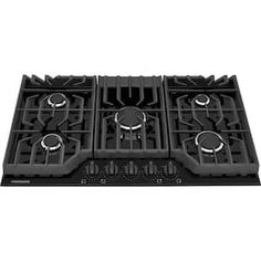 a black stove top with four burners