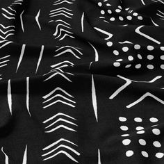 black and white fabric with arrows on it