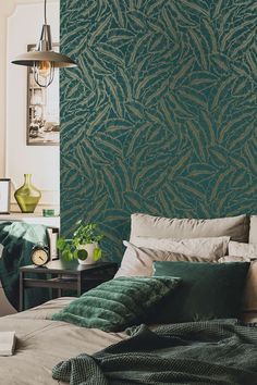 a bedroom with green wallpaper and bed in it