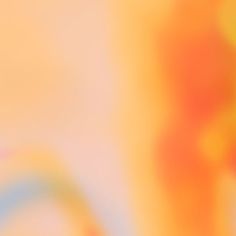 blurry image of an orange and yellow background