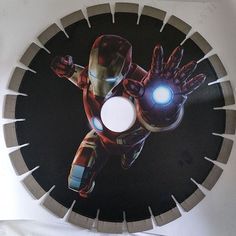 an iron man clock is shown on the wall