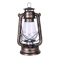 an old fashioned metal lantern on a white background