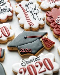 decorated cookies with graduation decorations and writing on them