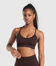 Gymshark Sweat Seamless Sports Bra - Heritage Brown | Gymshark Seamless High Stretch Sports Bra For Sports Events, High Stretch Seamless Sports Bra For Events, Seamless High Stretch Sports Bra For Events, Compressive Seamless Sports Bra For Events, High-stretch Seamless Sports Bra For Events, Sporty Brown Sports Bra For Gym, High Stretch Seamless Activewear For Sports, Seamless High Stretch Activewear For Sports, Supportive Seamless Activewear For Sports Events