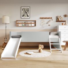 a child's bedroom with a slide, bed and dresser in the corner on the floor