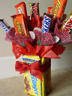 valentine's day gift ideas for guys with candy in a vase filled with paper fans