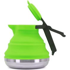 a green cup with scissors sticking out of it's side and the lid open