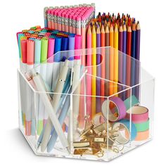 a clear container filled with lots of different colored pens and pencils on top of each other