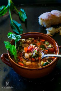 a close up of a bowl of soup on a table