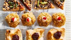 several pastries are arranged on a white tray with red noses and nose decorations, along with other food items